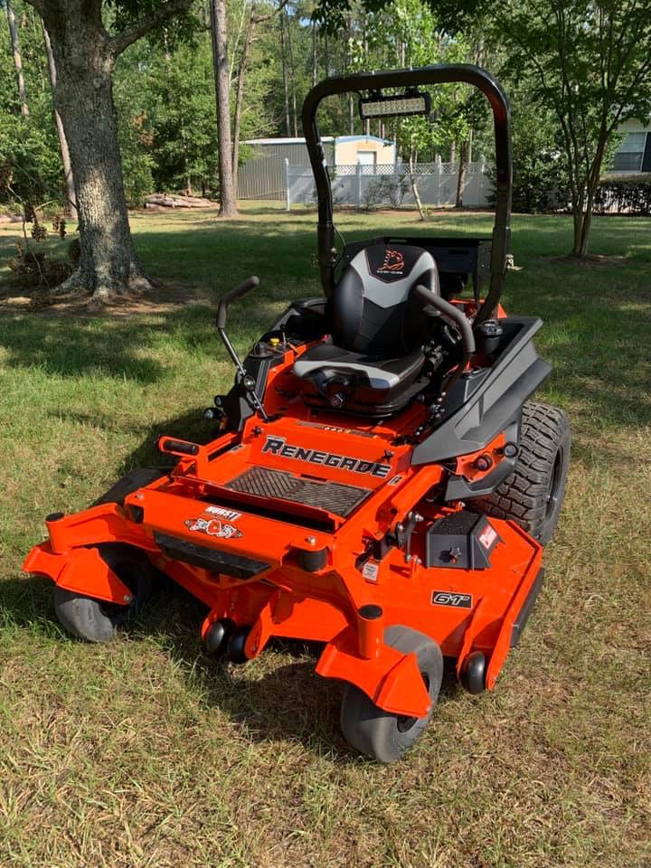 Orange Bad Boy Renegade zero-turn mower with a 61-inch deck on the property