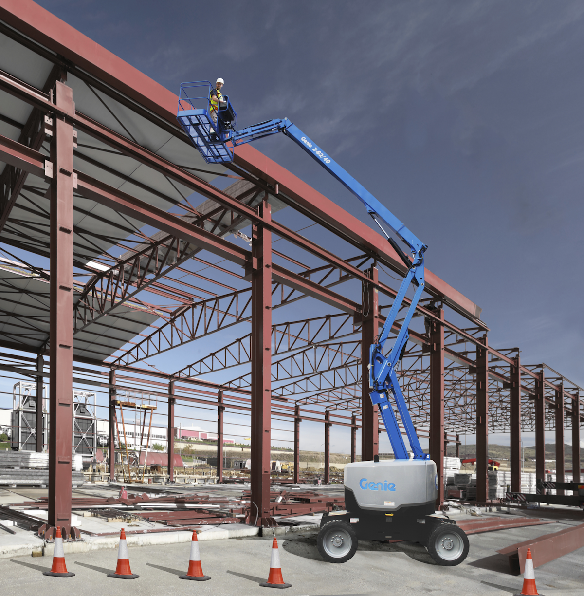 Blue Genie Z-62/40 articulating boom lift at a construction site