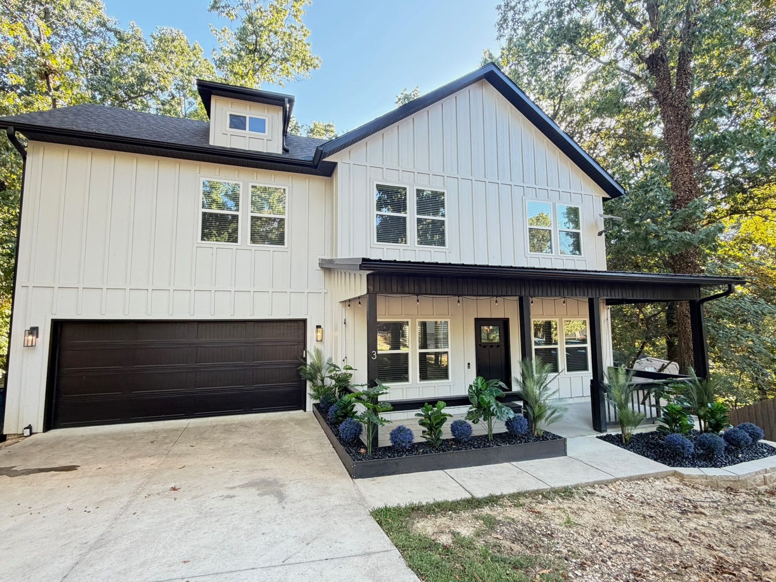 Driveway, garage, and front entry